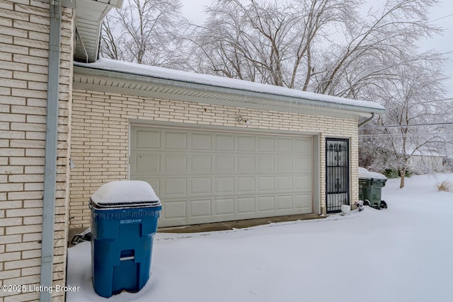 view of snow covered garage