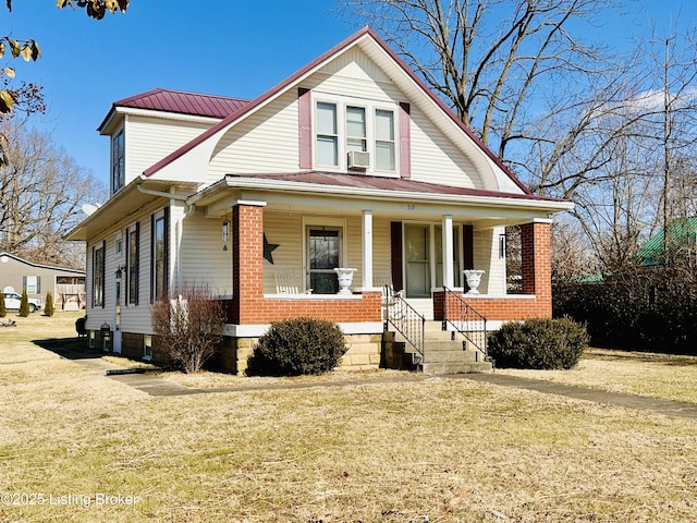 view of front of home with cooling unit, a porch, and a front yard