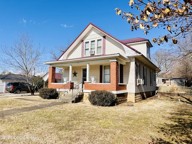 view of front of house with cooling unit, covered porch, and a front yard