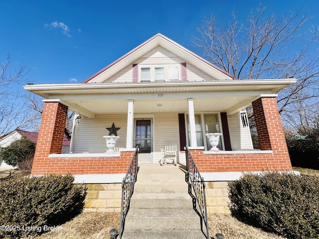 view of front of property featuring covered porch