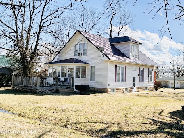 view of front of home with a wooden deck and a front lawn