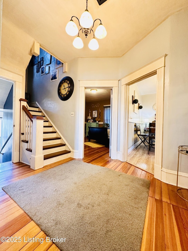 interior space with hardwood / wood-style floors and a notable chandelier