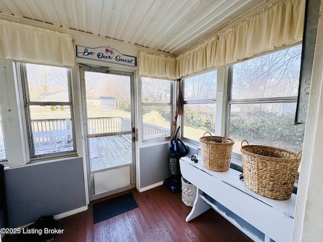 sunroom / solarium featuring wood ceiling