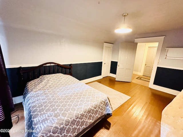 bedroom with hardwood / wood-style floors