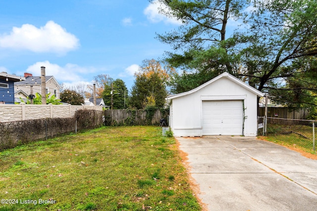 view of yard with a garage and an outdoor structure