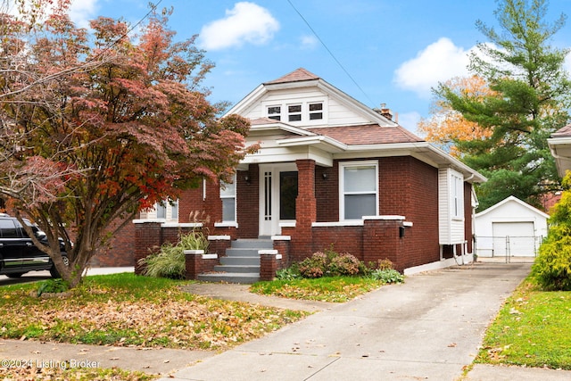 view of front of property featuring a garage and an outdoor structure