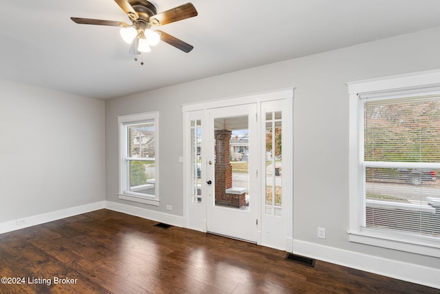 entryway with dark hardwood / wood-style floors and ceiling fan