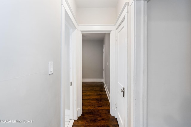 corridor with dark hardwood / wood-style floors