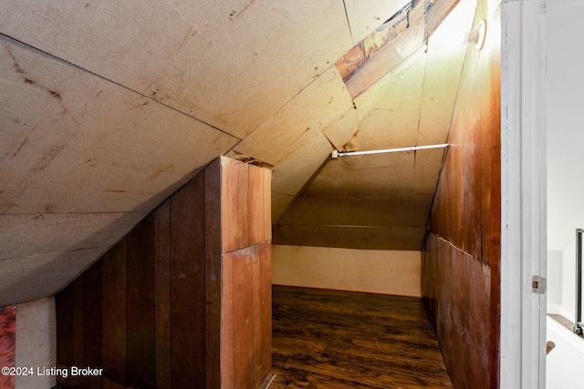 bonus room with dark hardwood / wood-style floors