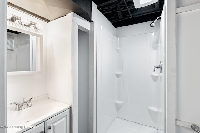 bathroom featuring vanity and walk in shower