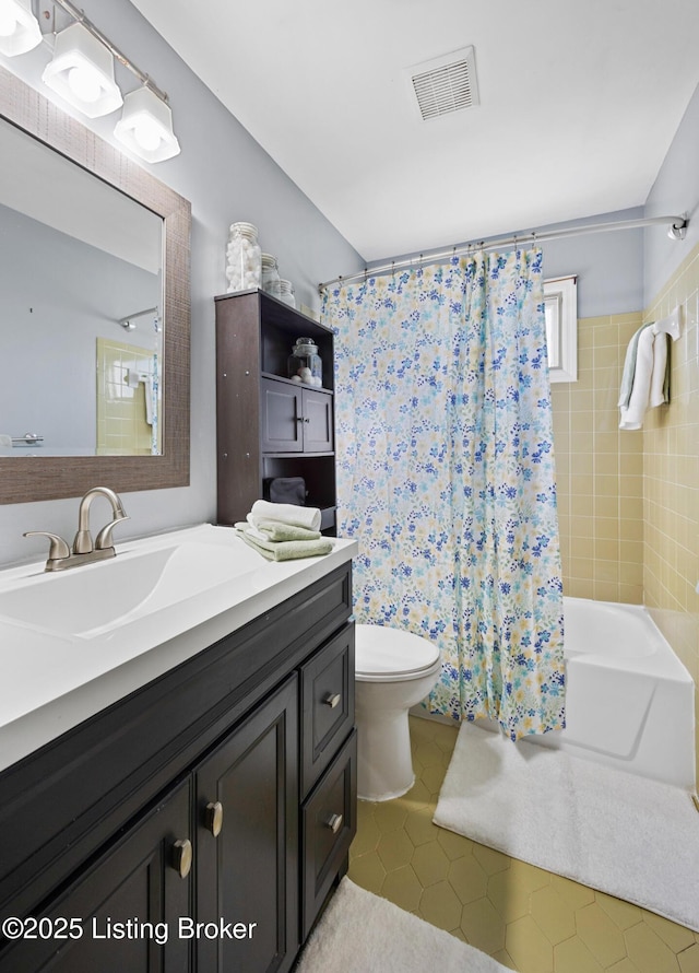 full bathroom with tile patterned flooring, vanity, shower / bathtub combination with curtain, and toilet