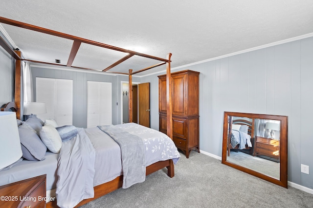 bedroom featuring crown molding, light carpet, and a textured ceiling