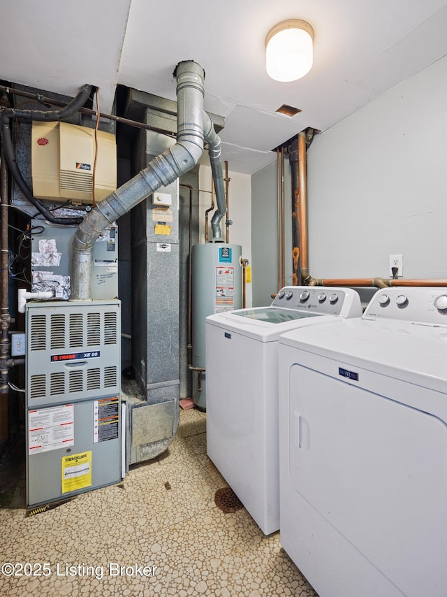 laundry room featuring gas water heater and independent washer and dryer