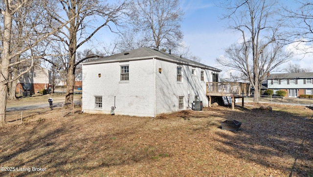 exterior space featuring cooling unit and a deck