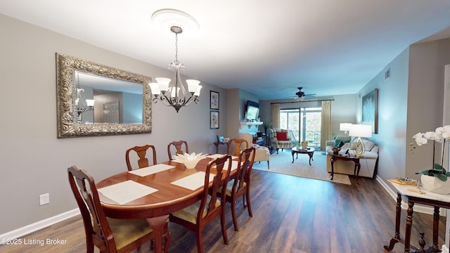 dining room featuring dark wood-type flooring and a chandelier