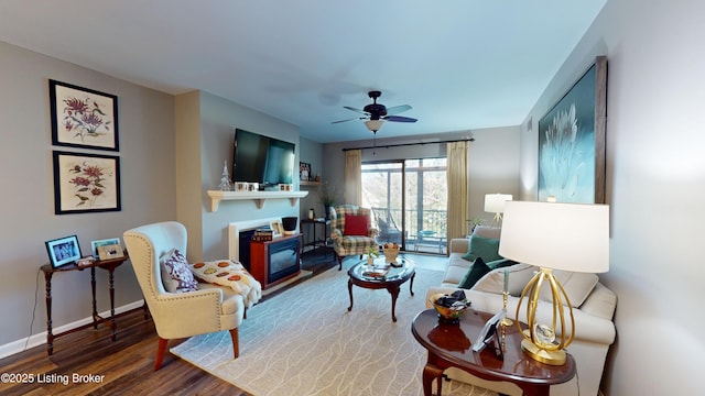 living room with hardwood / wood-style floors and ceiling fan