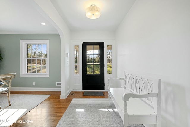 entryway with wood-type flooring