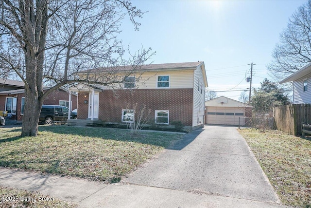 view of front of house with a garage, an outdoor structure, and a front yard