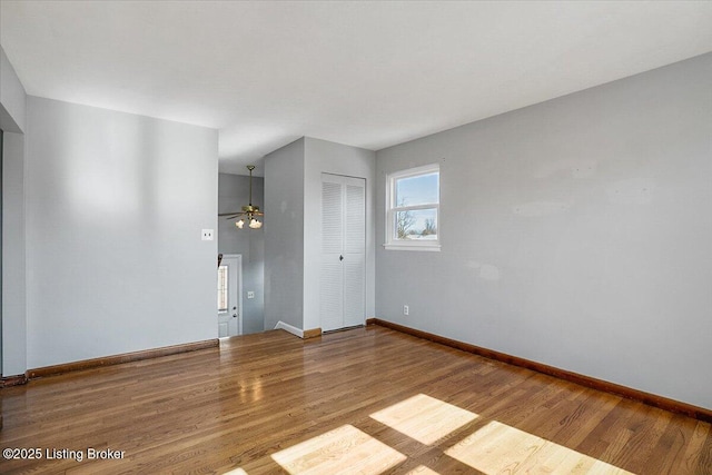 unfurnished room with hardwood / wood-style flooring and ceiling fan