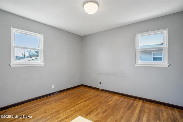 spare room featuring hardwood / wood-style flooring