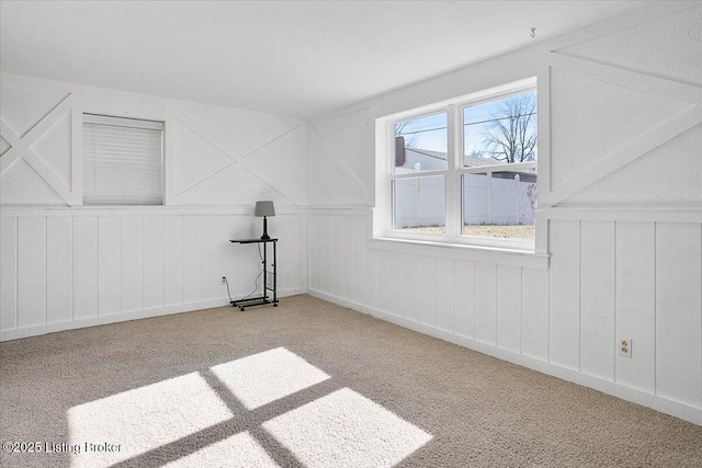 additional living space with light colored carpet