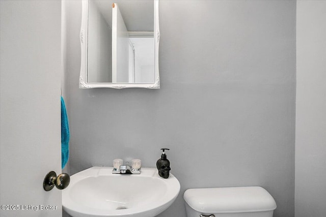 bathroom with sink and toilet