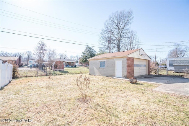 garage featuring a lawn