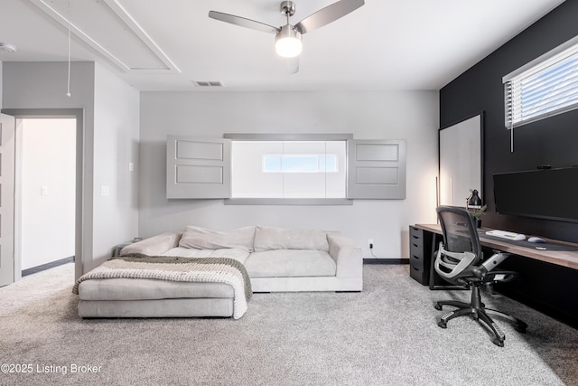 office area with light colored carpet and ceiling fan