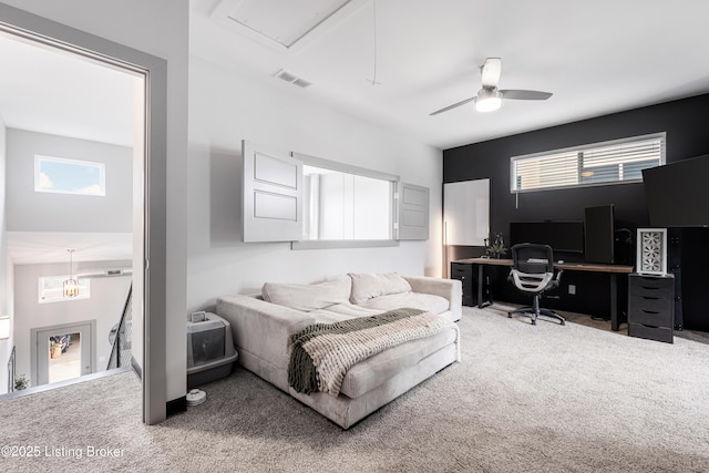 carpeted bedroom featuring multiple windows and ceiling fan