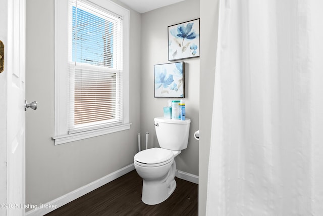 bathroom featuring hardwood / wood-style floors and toilet