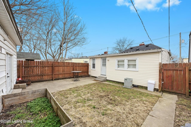 back of house featuring cooling unit and a patio area