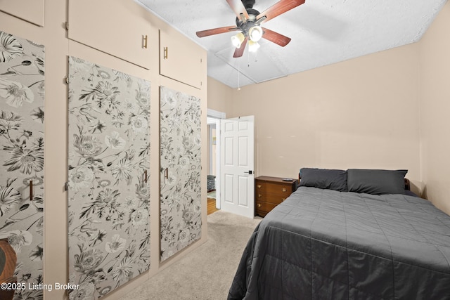 bedroom with lofted ceiling, light colored carpet, and ceiling fan