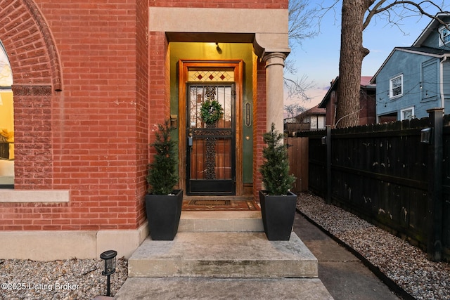 view of exterior entry at dusk