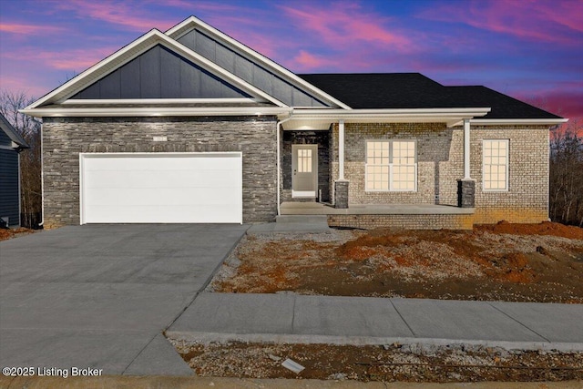 view of front facade with a garage and covered porch