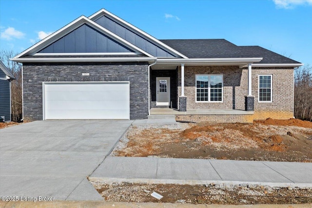 view of front of home with a garage and a porch