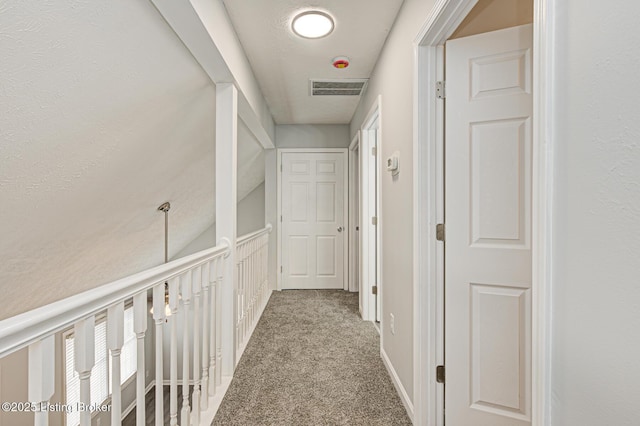 hallway with carpet floors