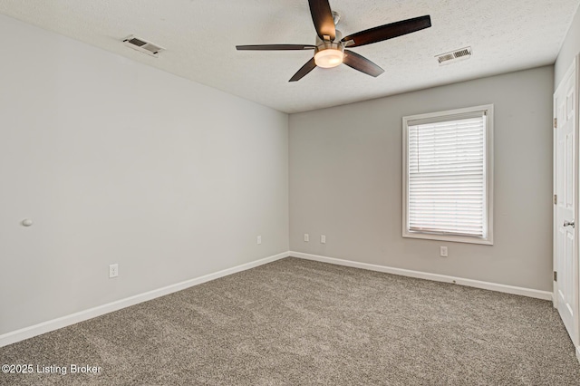 unfurnished room featuring ceiling fan, carpet flooring, and a textured ceiling