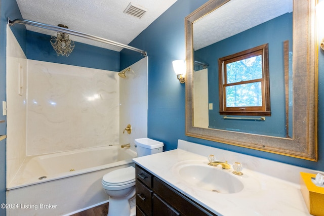 full bathroom featuring shower / washtub combination, toilet, vanity, and a textured ceiling