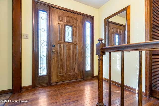 entrance foyer featuring dark hardwood / wood-style floors