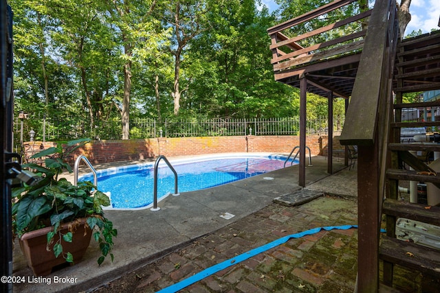 view of swimming pool with a patio area