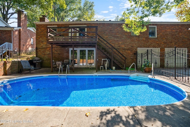 view of pool featuring area for grilling