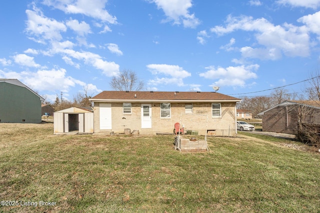 rear view of property with a storage shed and a lawn