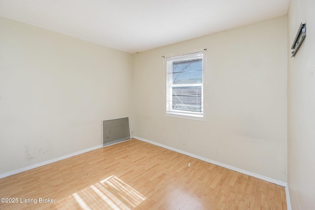 unfurnished room featuring wood-type flooring