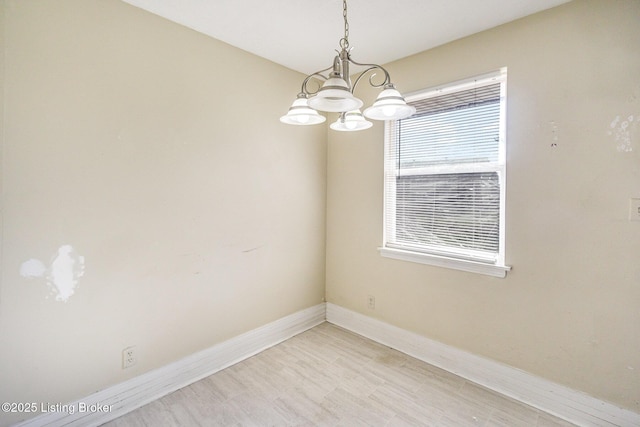 unfurnished room with light wood-type flooring