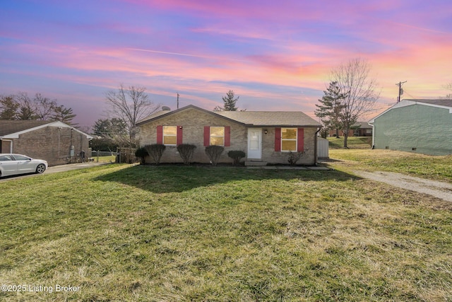 single story home with a yard