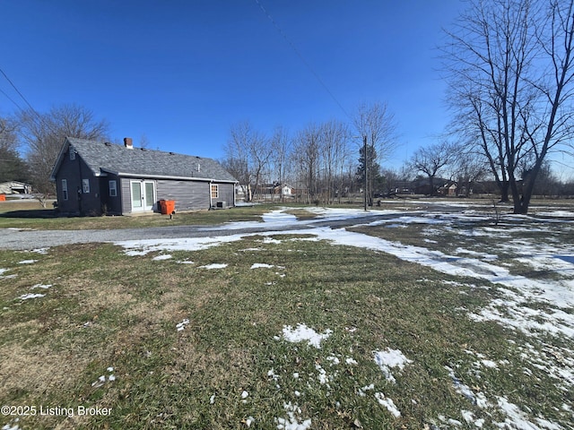 view of yard layered in snow