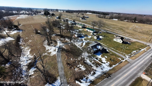 snowy aerial view featuring a rural view