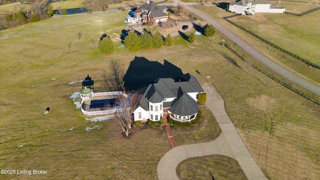 birds eye view of property with a rural view