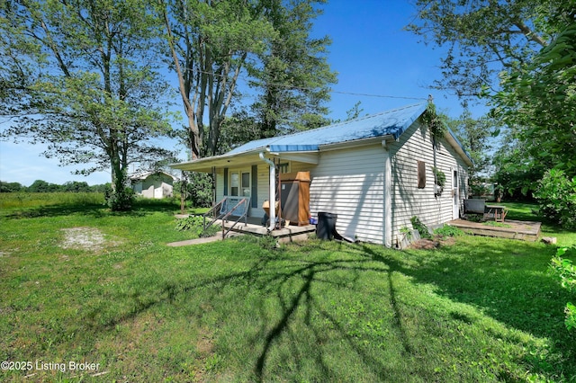105 Sherman St, Millwood, KY 42762 - back of property featuring a lawn and metal roof