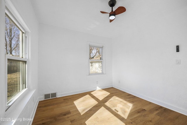 spare room featuring ceiling fan and wood-type flooring